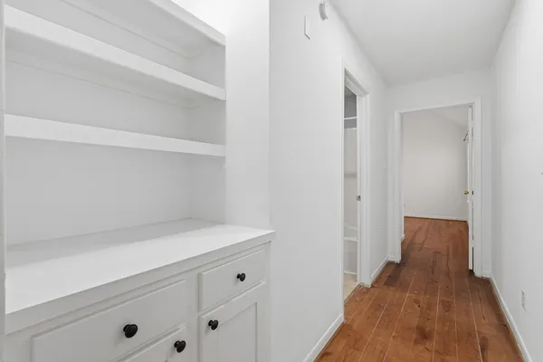 a view of a hallway with closet
