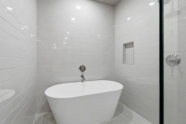 a white bath tub sitting in a bathroom