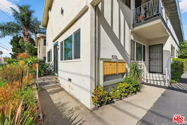 a front view of a house with an outdoor seating