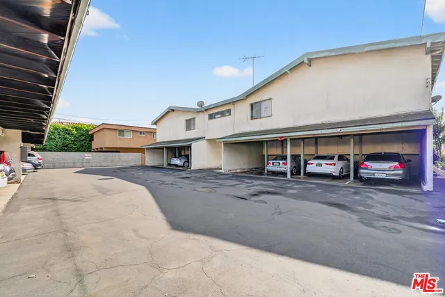 a front view of a building with parking
