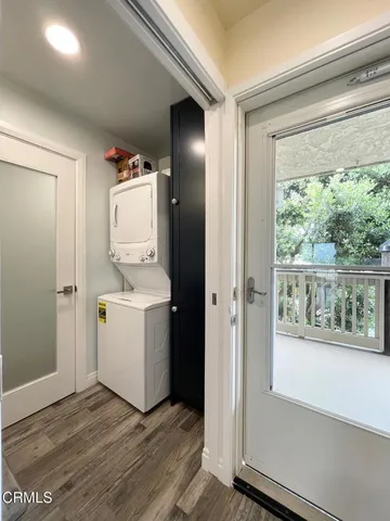 a bathroom with a glass door shower and a sink