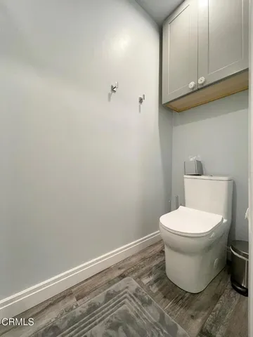 a view of a room with a ceiling fan