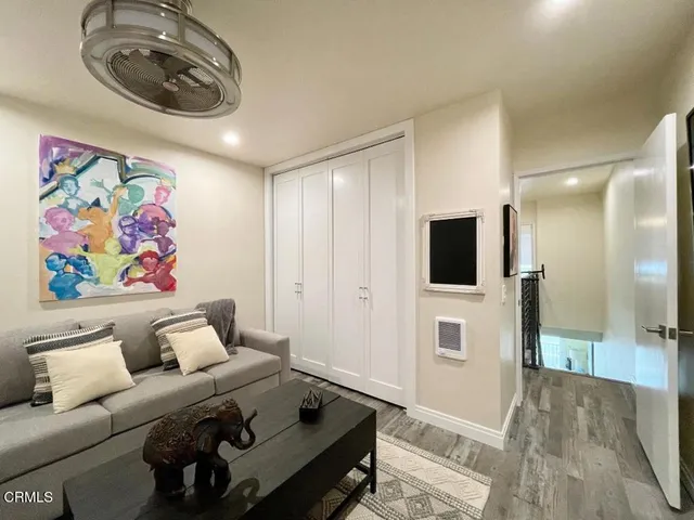 a view of a balcony with chair and potted plants
