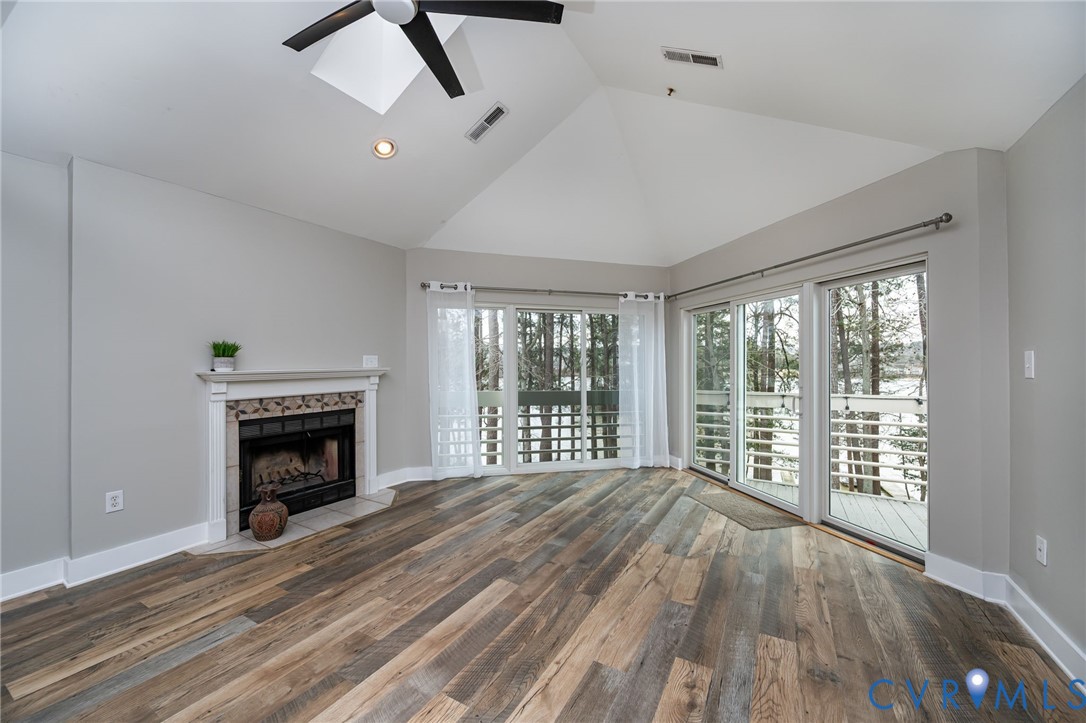112 Water Pointe Court Midlothian, VA 23112 - Photo 12 of 32 a view of an empty room with wooden floor fireplace and a window