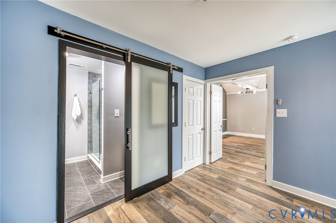 112 Water Pointe Court Midlothian, VA 23112 - Photo 16 of 32 a view of a hallway with wooden floor and a bathroom