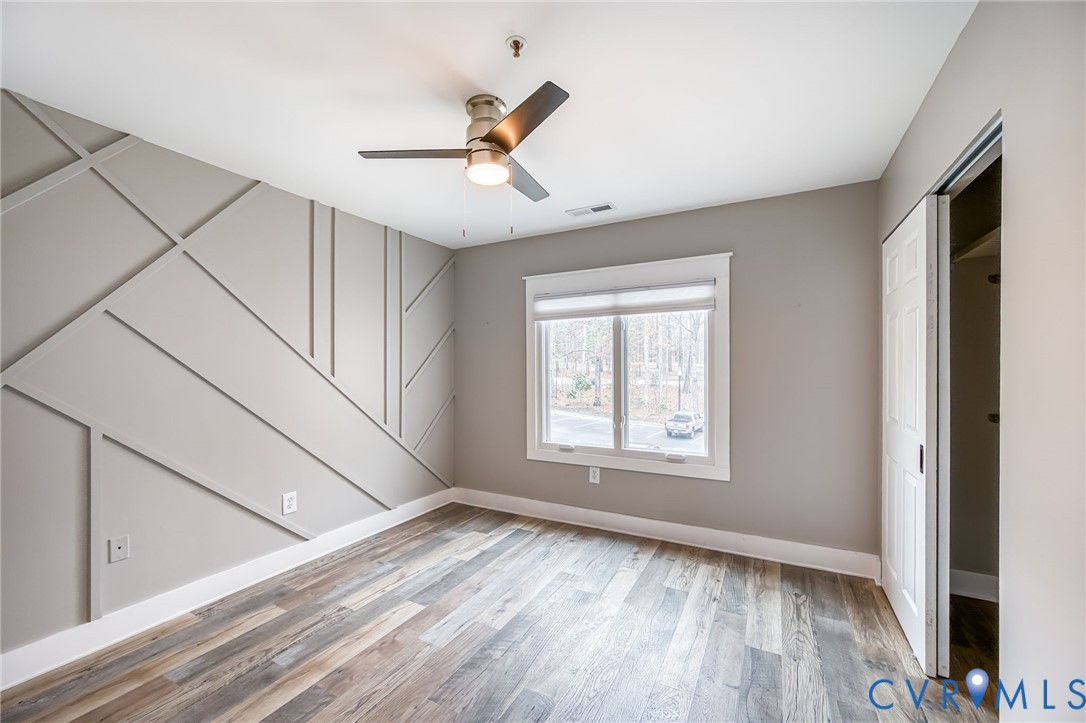 112 Water Pointe Court Midlothian, VA 23112 - Photo 22 of 32 a view of an empty room with wooden floor and a window
