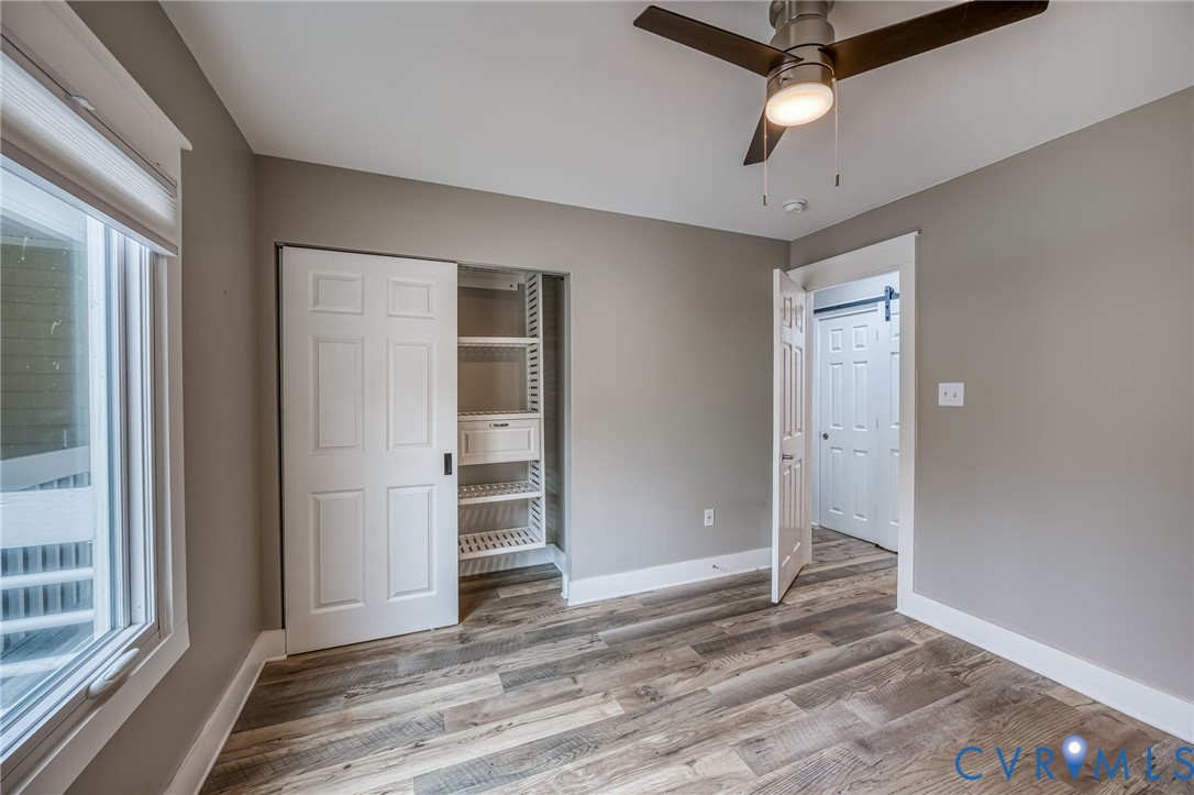 112 Water Pointe Court Midlothian, VA 23112 - Photo 23 of 32 an empty room with closet and a ceiling fan