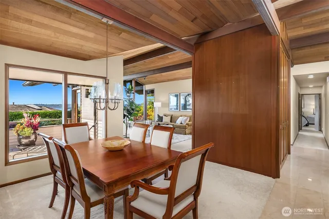 a dining room with furniture and window