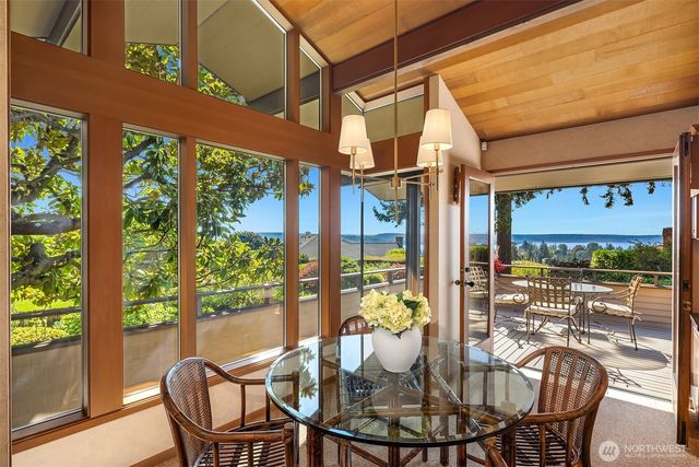 a view of a dining room with furniture window and outside view