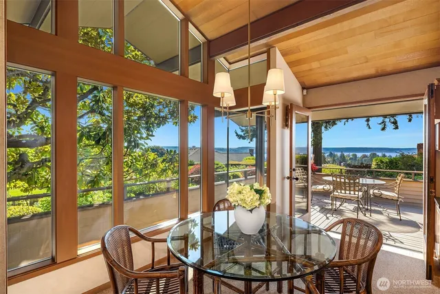 a view of a dining room with furniture window and outside view