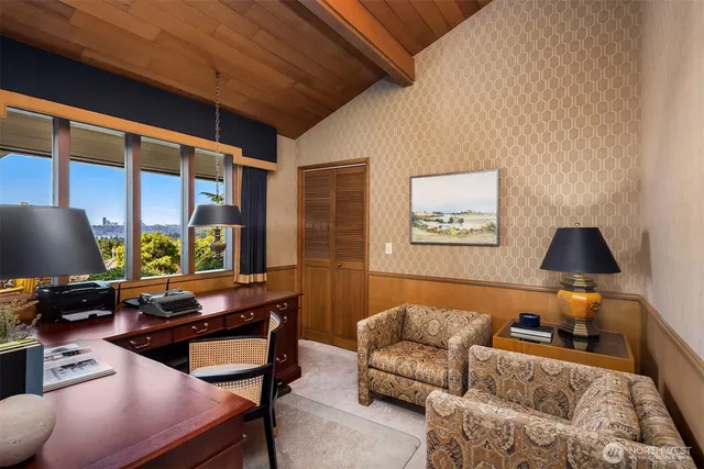 a bedroom with a bed couch and window