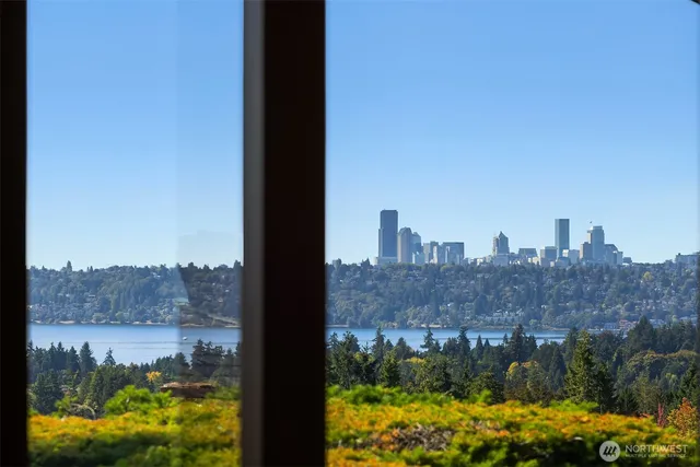 a spacious bedroom with a bed and a lamp