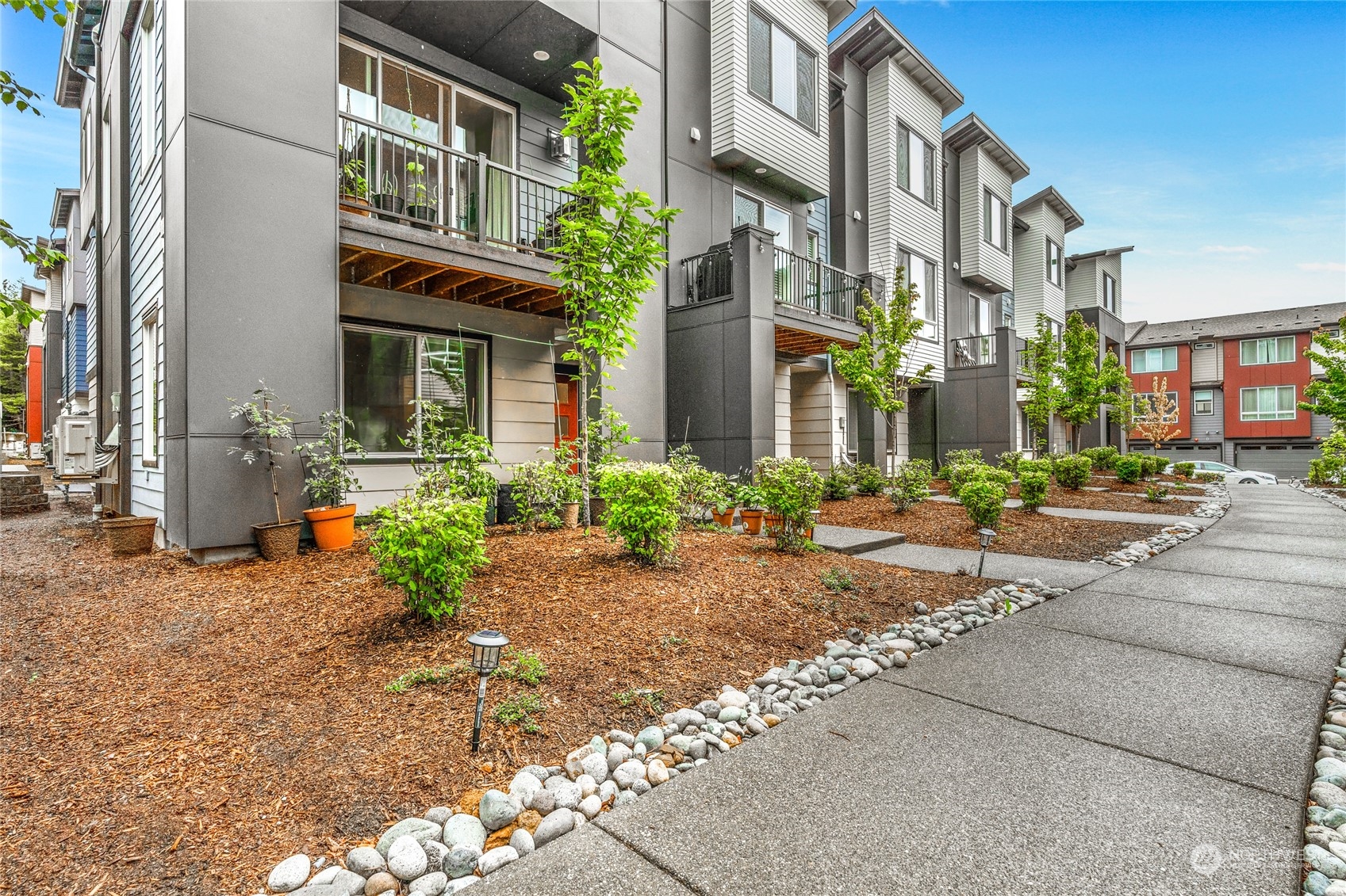 616 237th Place Southeast, Unit F Bothell, WA 98021 - Photo 1 of 27 a view of a building with a street