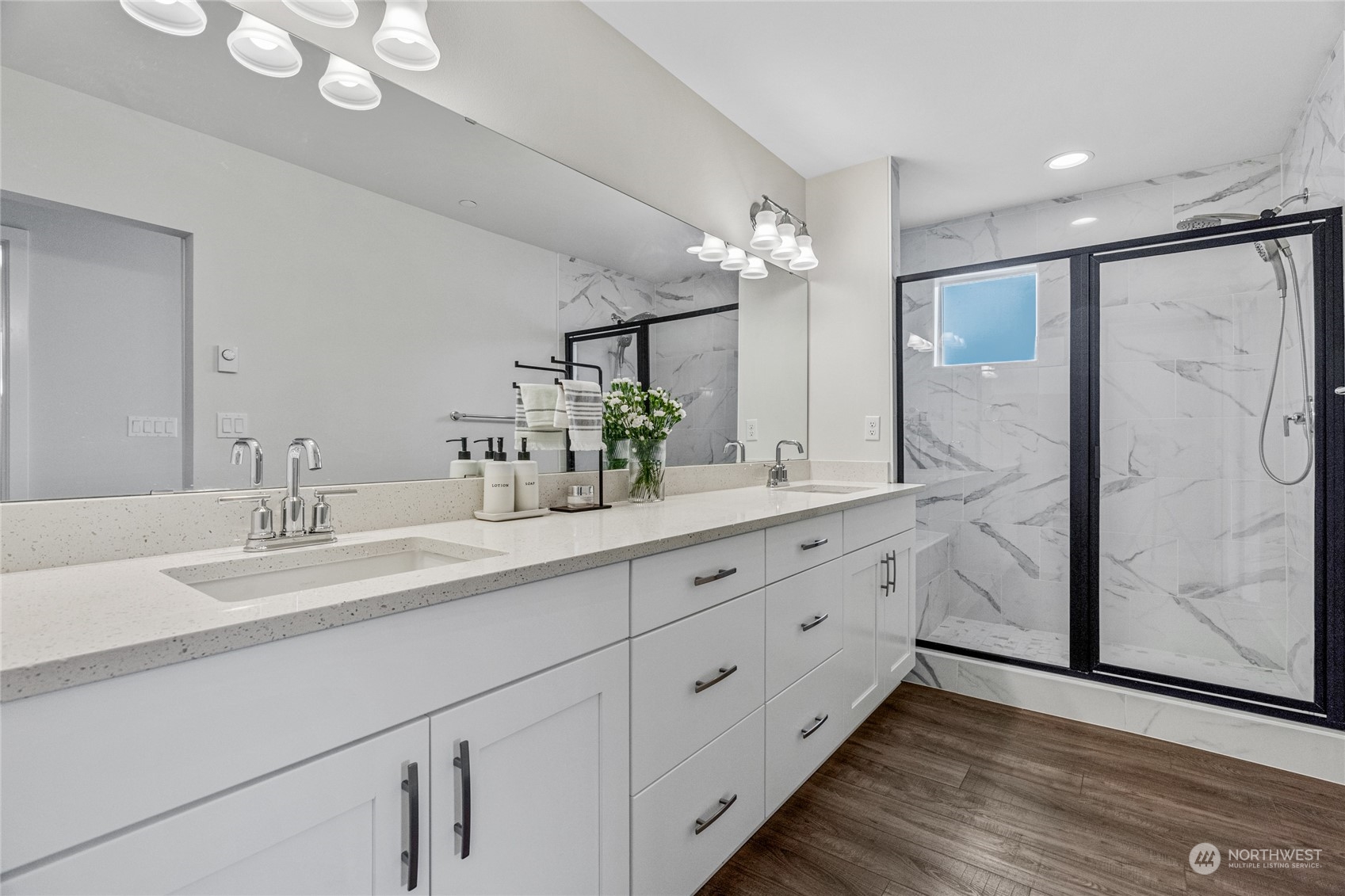 616 237th Place Southeast, Unit F Bothell, WA 98021 - Photo 26 of 27 a bathroom with a double vanity sink mirror and shower