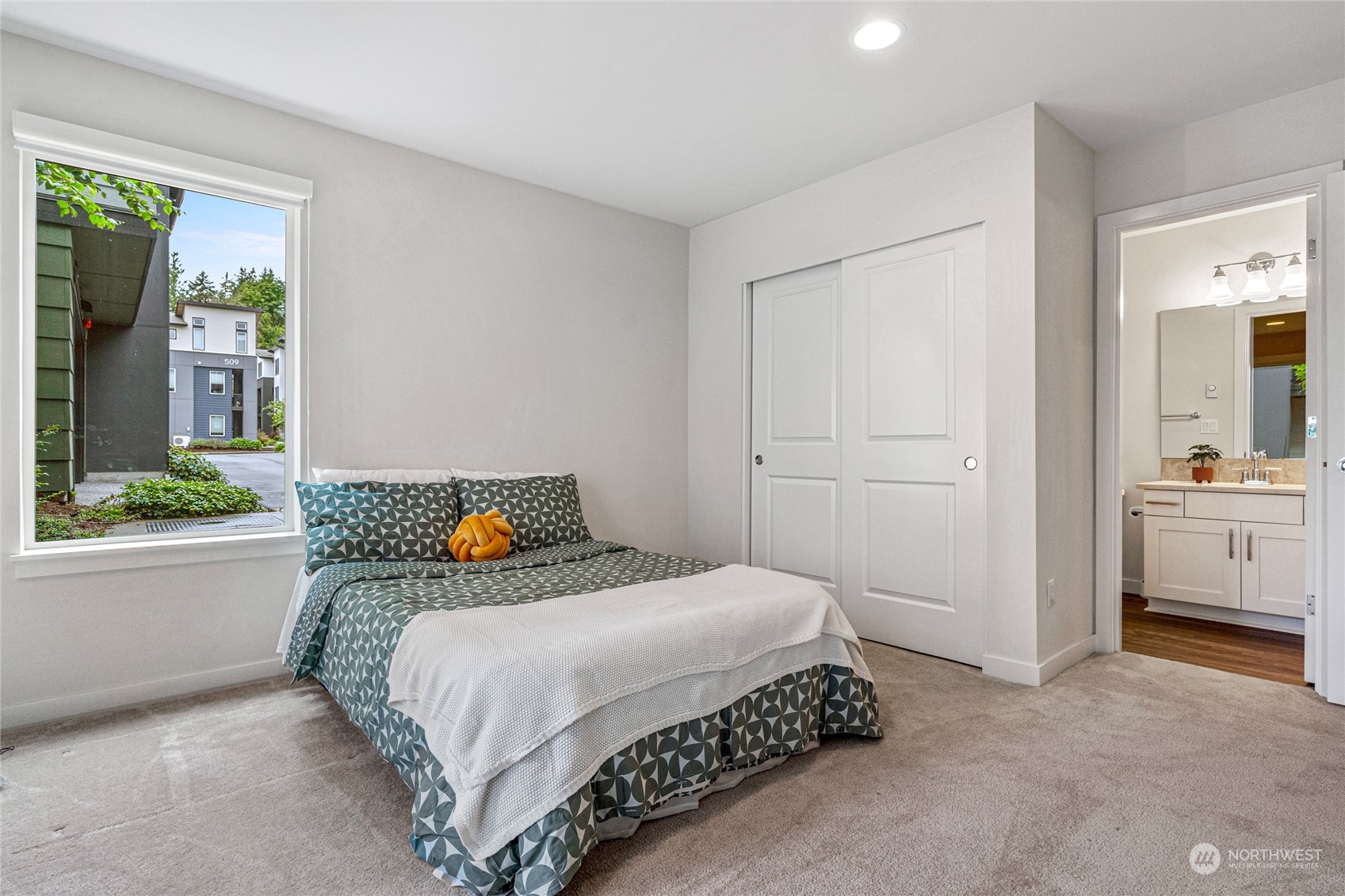 616 237th Place Southeast, Unit F Bothell, WA 98021 - Photo 6 of 27 a bedroom with a bed and a window