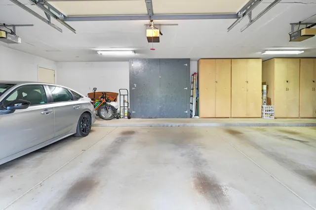a view of parking garage with cars