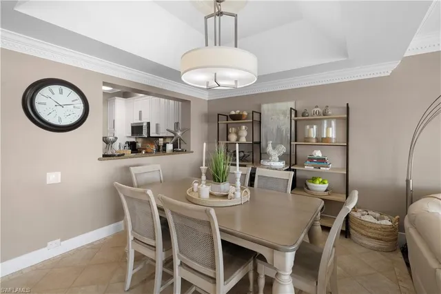 a view of a dining room with furniture and window