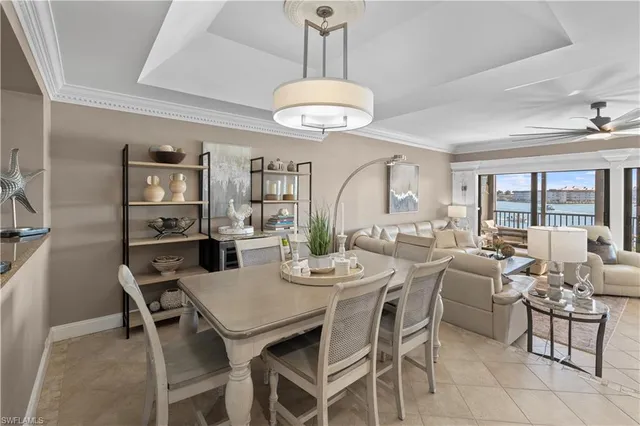 a view of a dining room with furniture wooden floor and chandelier