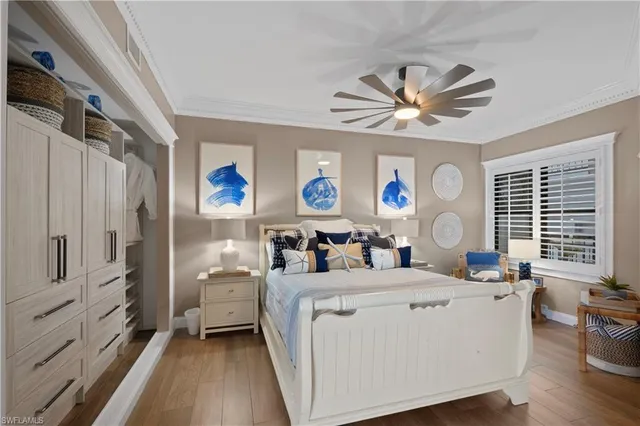 a room with kitchen island a bed furniture and a window