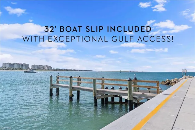 a view of a swimming pool with outdoor seating