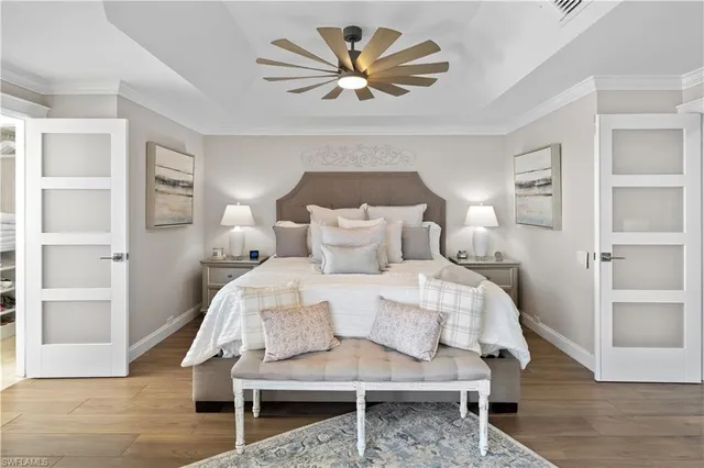 a bedroom with a bed and a view of closet