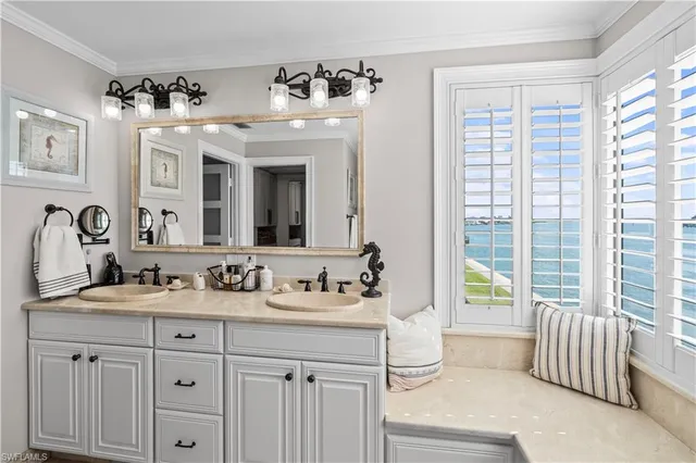 a bathroom with a sink double vanity and a mirror