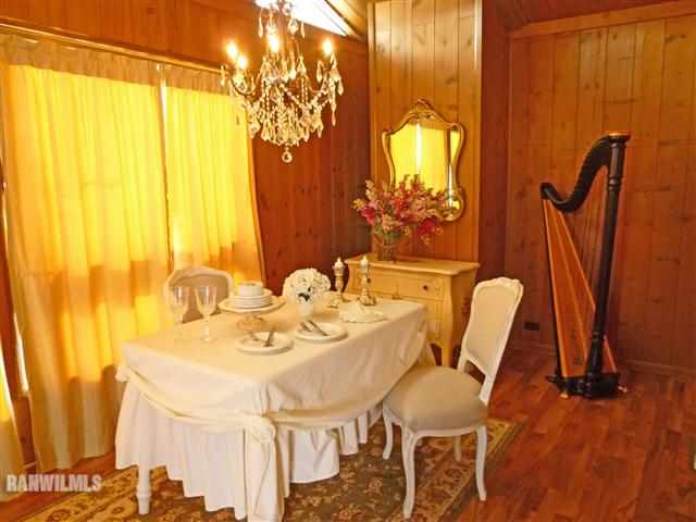 4290 South Massbach Road Stockton, IL 61085 - Photo 4 of 12 a view of a dining room with furniture and chandelier
