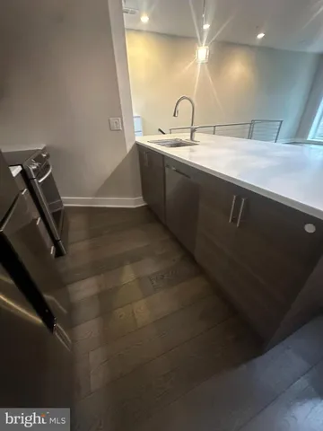 a stove top oven sitting inside of a kitchen