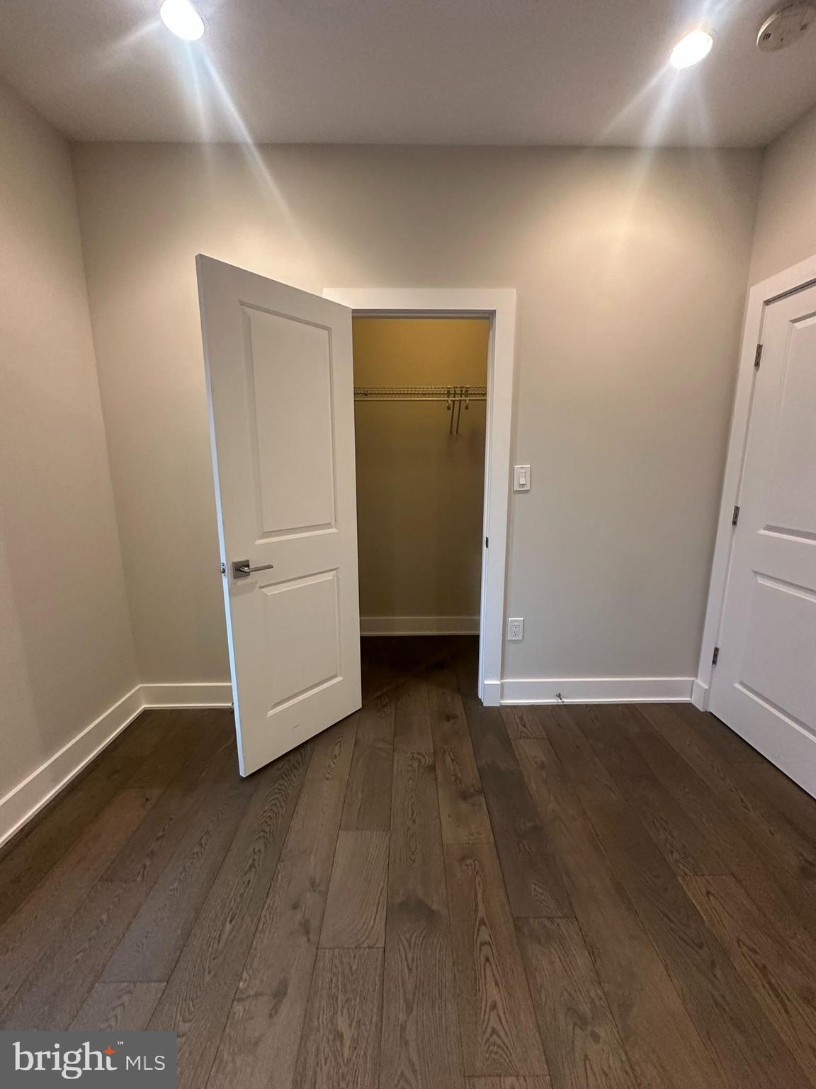 1852 3rd Street Northwest, Unit C Washington, DC 20001 - Photo 25 of 56 a view of an empty room with wooden floor and closet