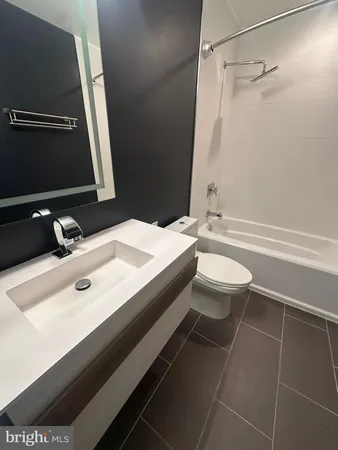 a bathroom with a toilet and a sink
