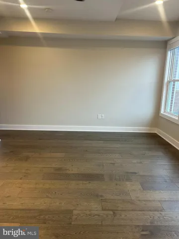 a room with gym equipment and a shower