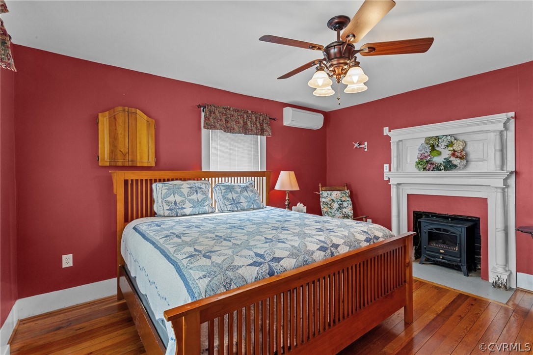 4851 Three Chopt Road Louisa, VA 23093 - Photo 11 of 39 a bedroom with a bed and a fireplace