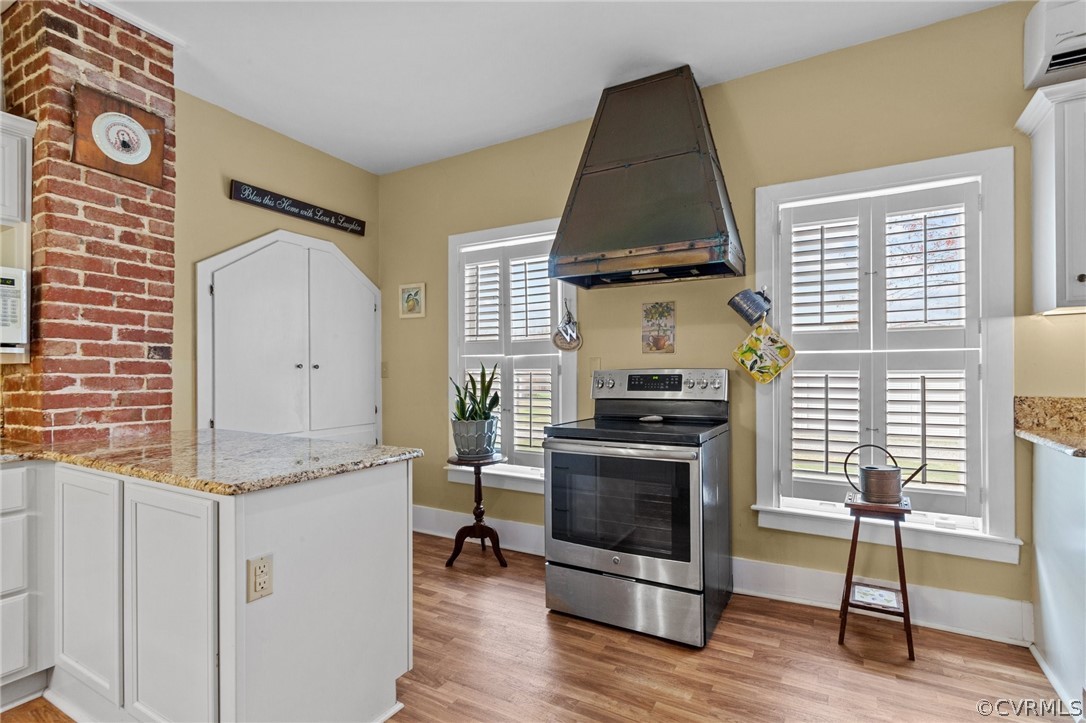 4851 Three Chopt Road Louisa, VA 23093 - Photo 17 of 39 a room with furniture and a fireplace