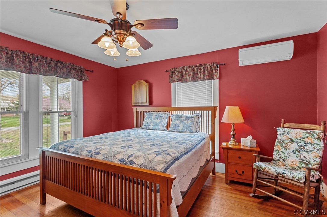 4851 Three Chopt Road Louisa, VA 23093 - Photo 10 of 39 a bedroom with a bed and a chandelier