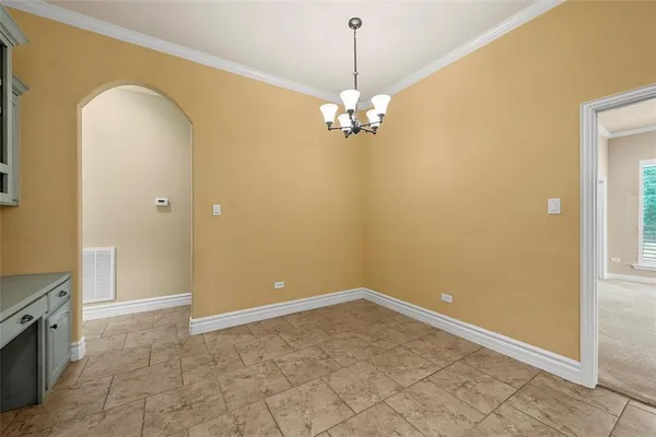 a view of a livingroom with a chandelier fan