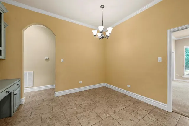 a view of a livingroom with a chandelier fan