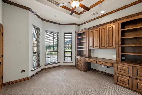 a view of an empty room with furniture and closet