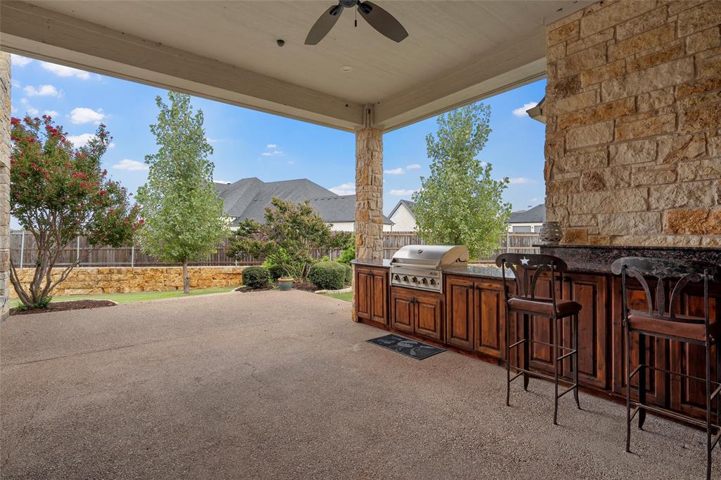 7030 Flagstone Circle Waco, TX 76657 - Photo 40 of 40 a view of a patio with a fireplace