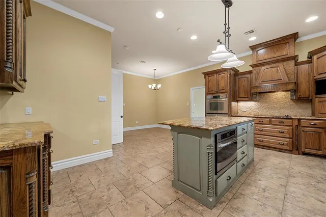 a kitchen with stainless steel appliances granite countertop a stove and a sink