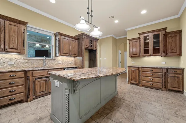 a kitchen with a stove kitchen island and fireplace