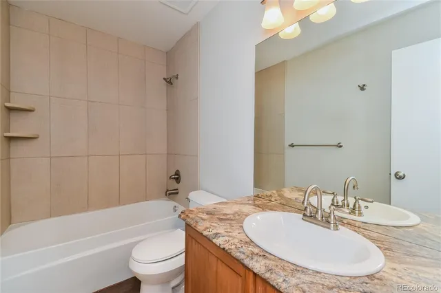 a view of a backyard with a deck and a garden