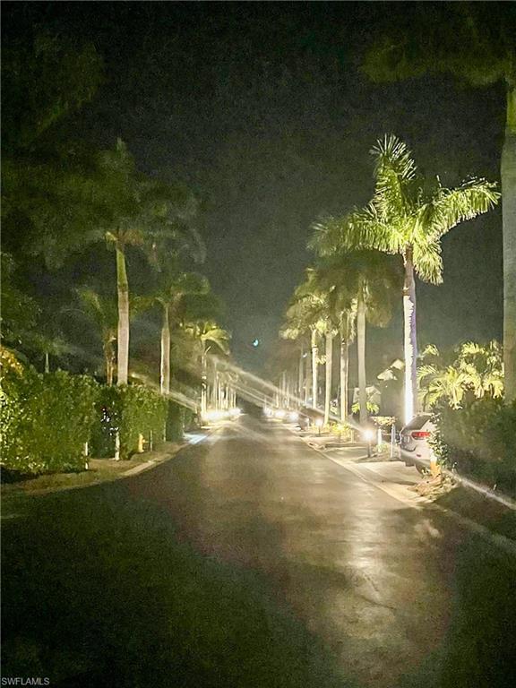 13627 Snook Circle Naples, FL 34114 - Photo 9 of 10 a view of a fountain in middle of the building