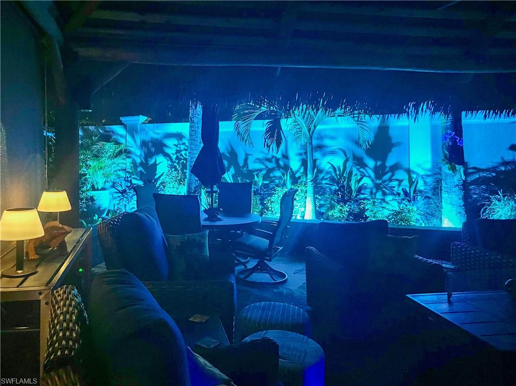 13627 Snook Circle Naples, FL 34114 - Photo 10 of 10 a vase of flowers sitting on a table in front of a house