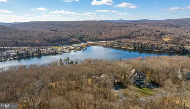 a view of a patio with chairs and a yard