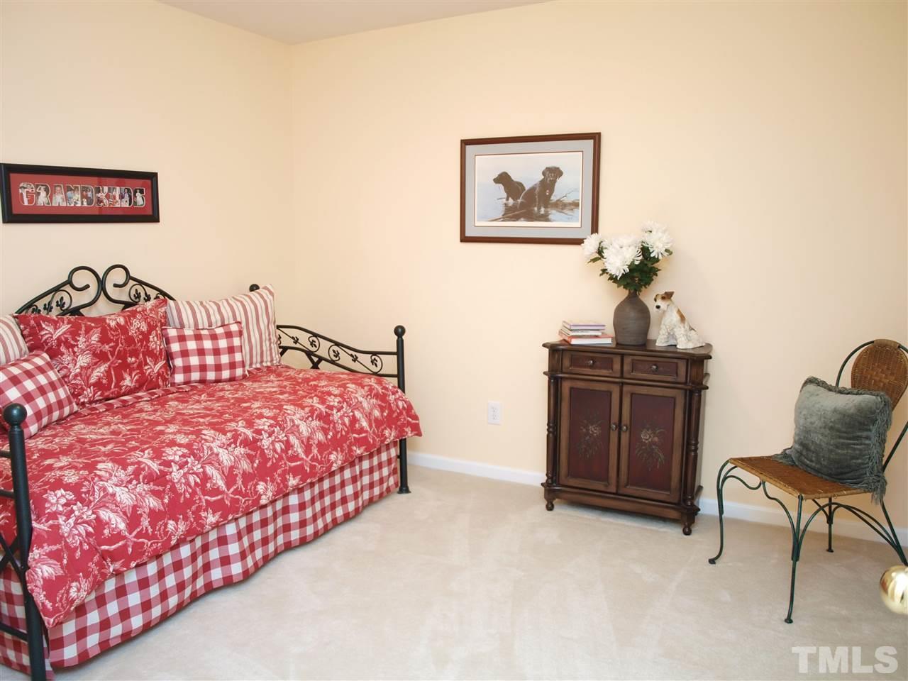 10465 Dapping Drive Raleigh, NC 27614 - Photo 11 of 19 a bedroom with a bed and chair