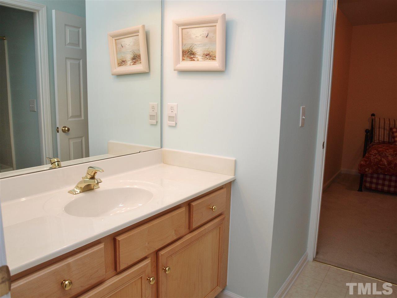 10465 Dapping Drive Raleigh, NC 27614 - Photo 12 of 19 a bathroom with a sink and a mirror