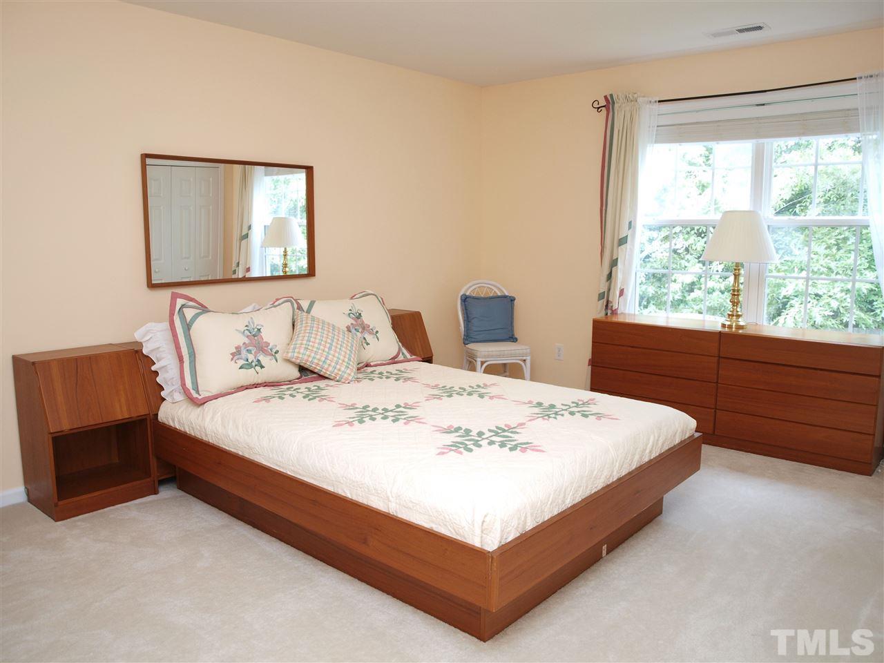 10465 Dapping Drive Raleigh, NC 27614 - Photo 13 of 19 a bedroom with a bed and window