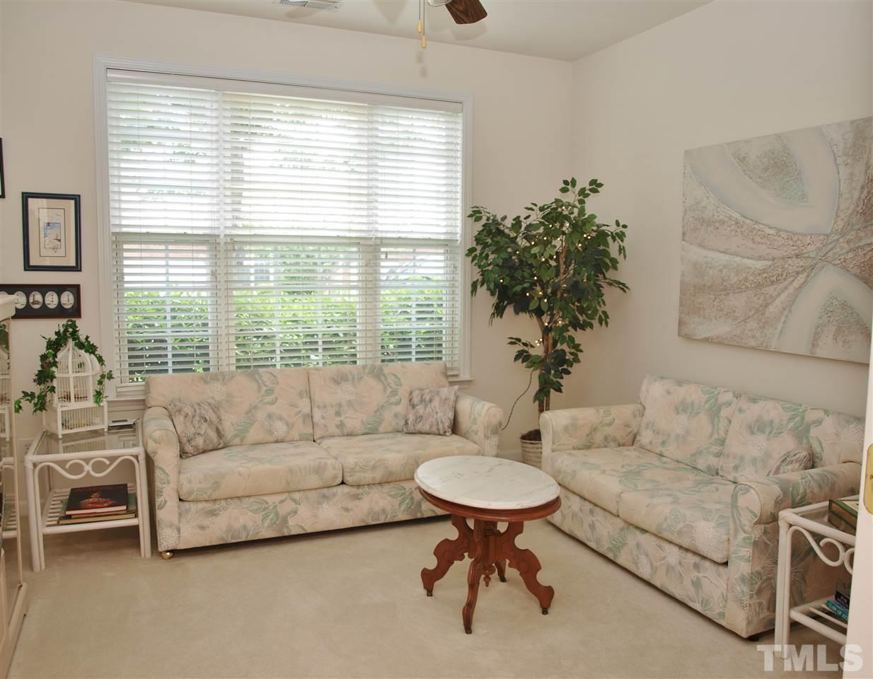 10465 Dapping Drive Raleigh, NC 27614 - Photo 14 of 19 a living room with furniture and a large window