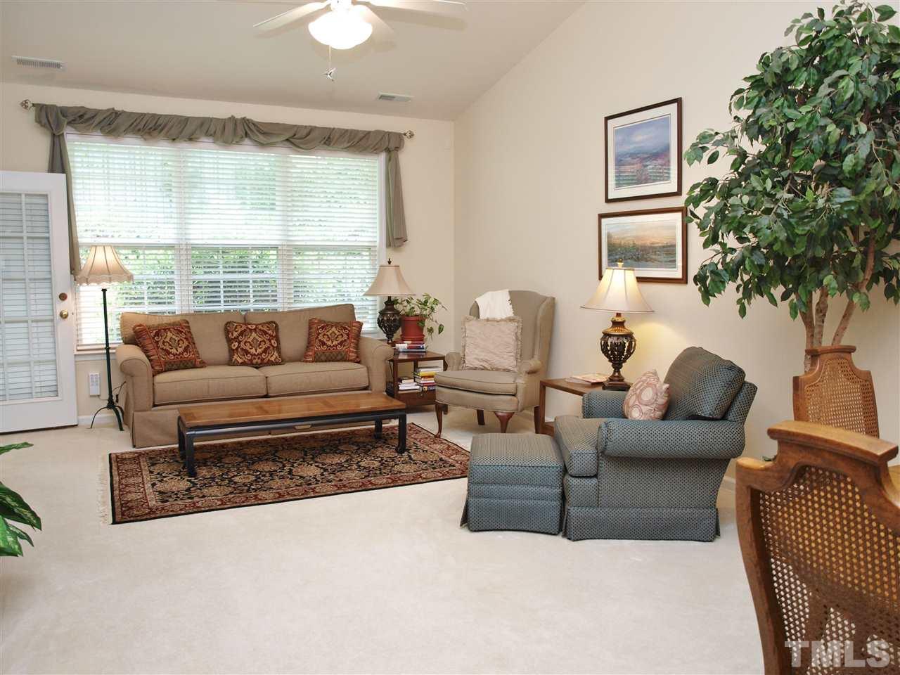 10465 Dapping Drive Raleigh, NC 27614 - Photo 6 of 19 a living room with furniture and a large window