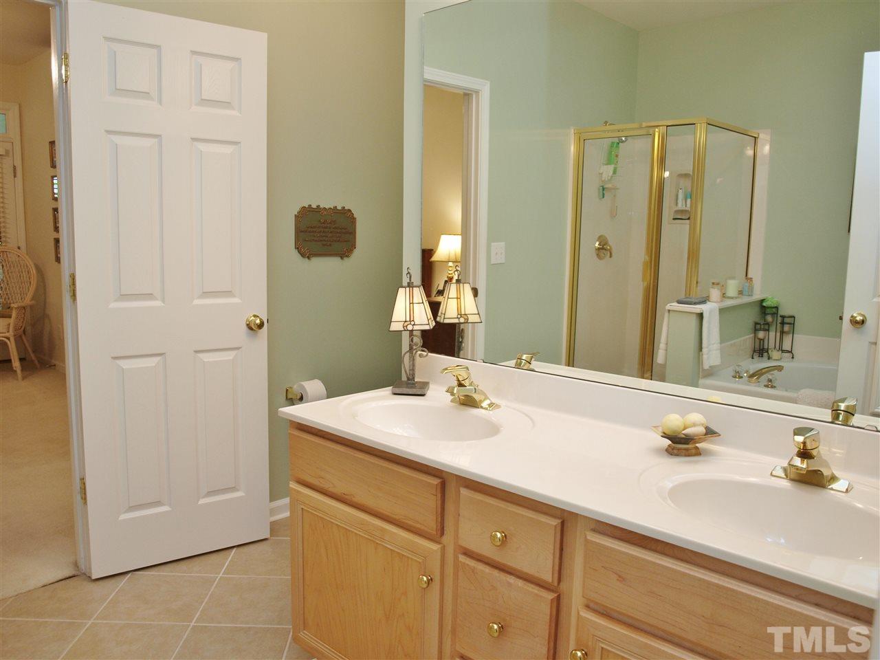 10465 Dapping Drive Raleigh, NC 27614 - Photo 8 of 19 a bathroom with a sink and a mirror